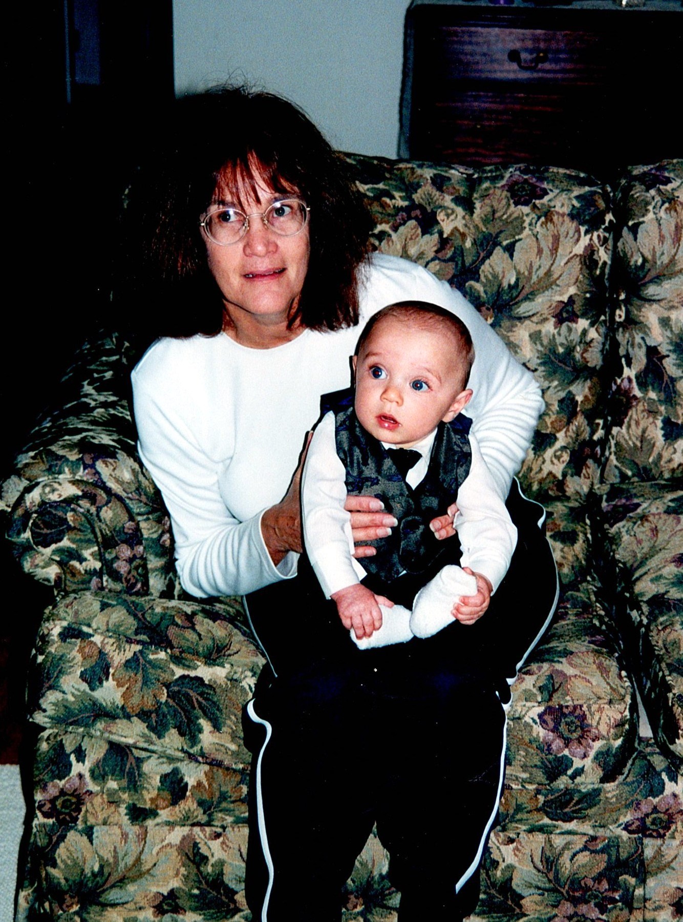Ann Filipone seated with a baby in her lap