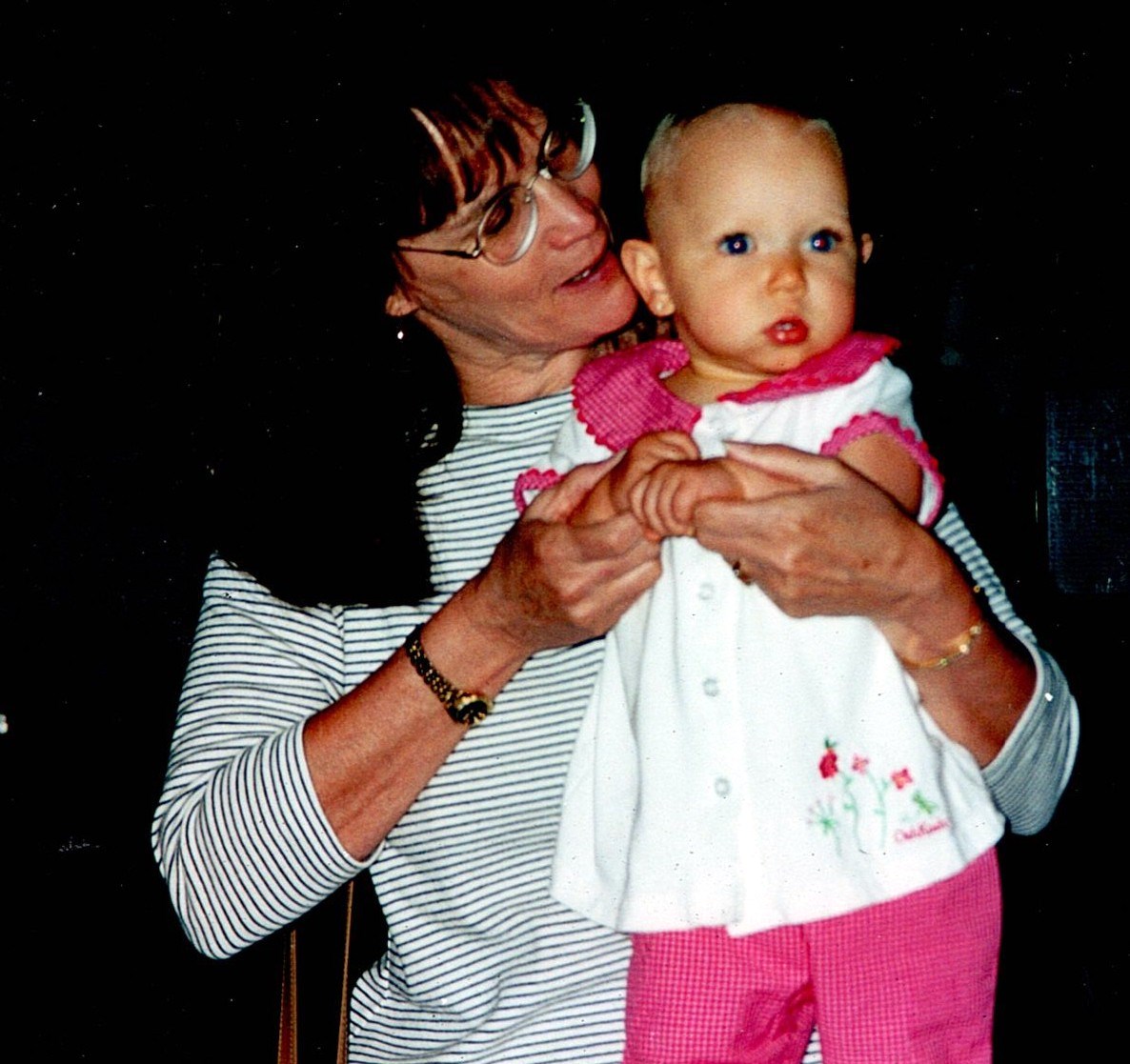 Ann Filipone holding a baby in her arms